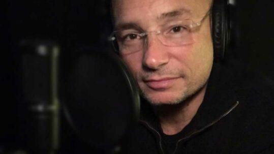 Anthony Melchiorri recording a podcast